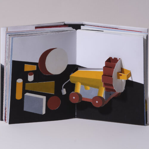 Livre pop up ouvert "Jeux d'enfance" avec un lion qui surgit de la page